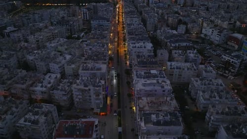 High Angle View of Long Straight Illuminated Street in Residential Urban Borough Rows of Multistorey
