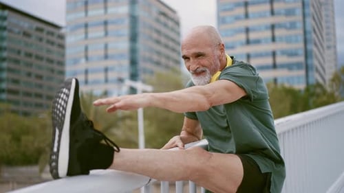 Senior Man Stretching Leg in the City