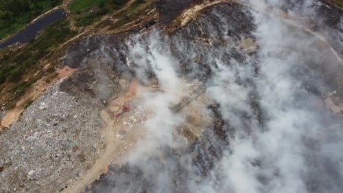 Aerial view smoke release from burning of garbage dump site