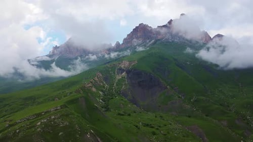 Aerial View of the Mountainside and Beautiful Alpine Green Meadows