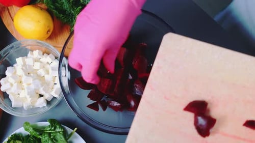 Putting Chopped Beetroot in a Deep Bowl