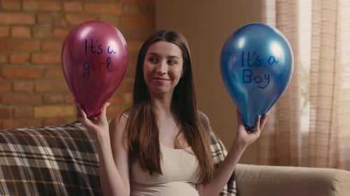 Pregnant Woman with Baby Gender Reveal Balloons
