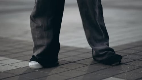 Young Woman Dancing Hip Hop on the Street