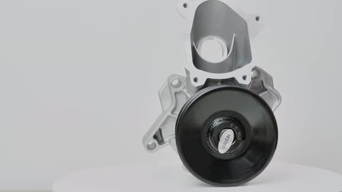 Car Water Pump Rotating on White Background