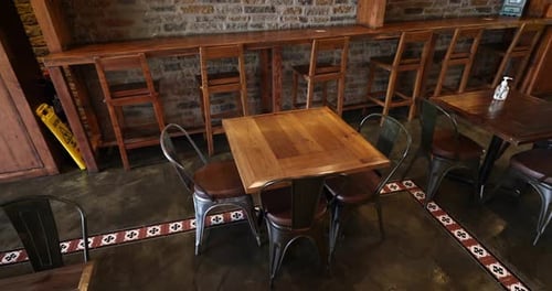tables and chairs set up at a restaurant