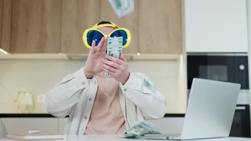 Man with Money and Novelty Sunglasses