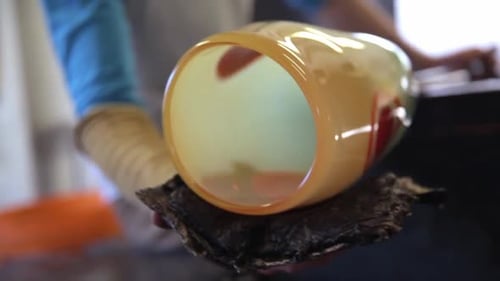 Glass Blower Shaping Yellow and Red Glass