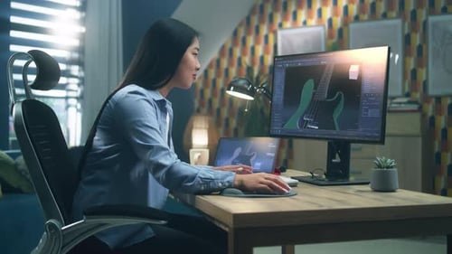 Asian Woman Making 3D Graphic of Guitar