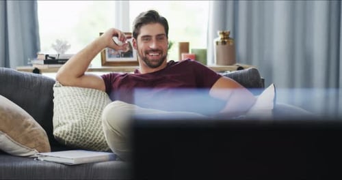Man Relaxing at Home Watching Television