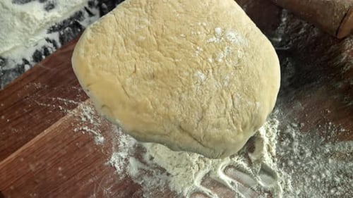 Fresh Dough Falls on Cutting Board View From Above Filmed on a Highspeed Camera at 1000 Fps