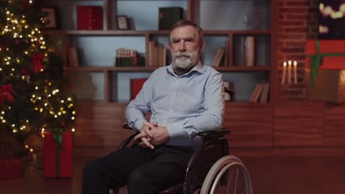 Elderly Man Smiles in Wheelchair at Christmas