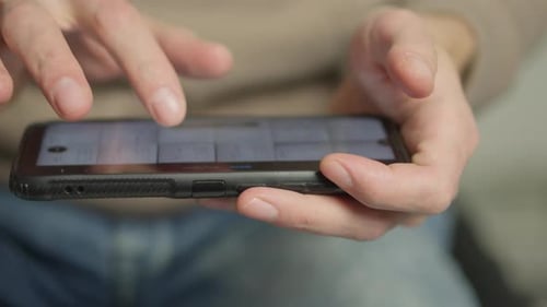 Close-up of Fingers Using Smartphone Touchscreen
