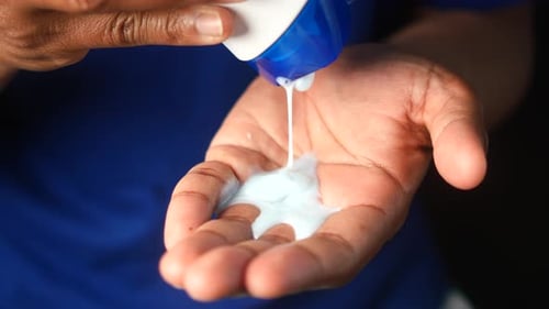 Lotion Being Poured Into Hand, Close Up