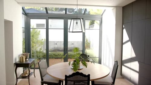 Modern Dining Room with Garden View and Pendant Lamp