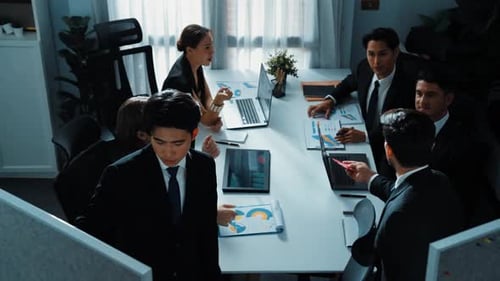 Top view of smart manager present financial graph to diverse team. Directorate.