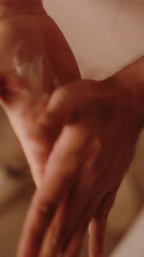Rubbing Massage Cream Into Hands