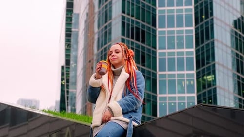 Stylish Woman Drinking Coffee Outside in City