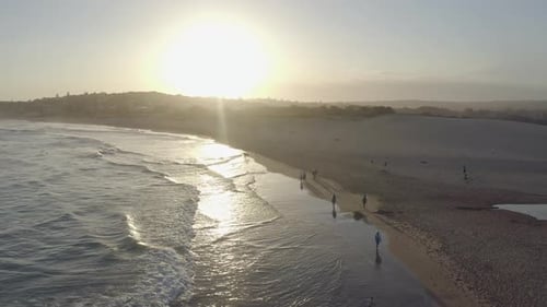 4k video footage of people at the beach during sunset