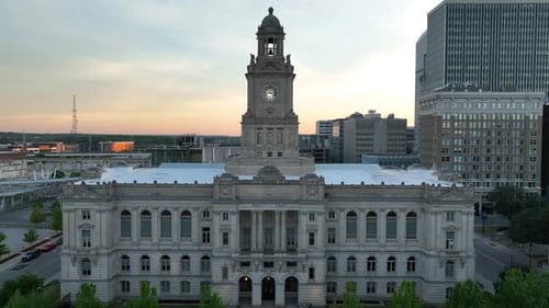 Polk County Courthouse in downtown Des Moines, Iowa during sunset. Aerial rising shot.