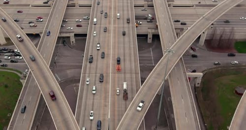 High Angle View of Complex Multi-Level Highway Interchange and Urban Traffic