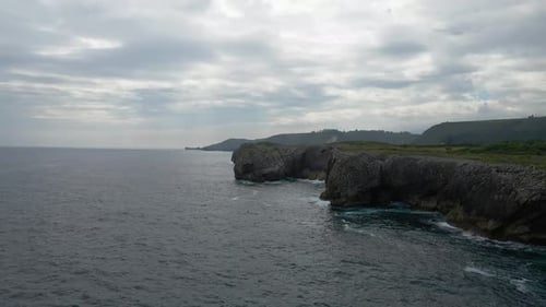 Aerial view of Asturias coastline. Drone shot of sea, cliff, rocks and the Atlantic ocean in Spain.