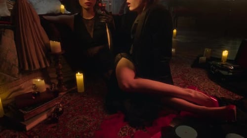 Portrait of Seductive Vampire Woman Sipping Blood, Man Gazing Intently at Her