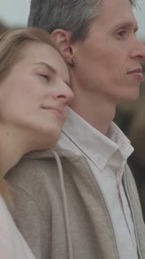 Romantic Couple Embracing on Rocky Beach