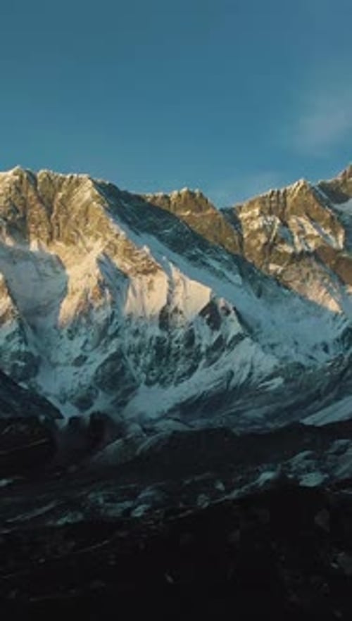 Nuptse Mountain and Lhotse South Face at Sunset Himalaya Nepal Aerial View Vertical Video