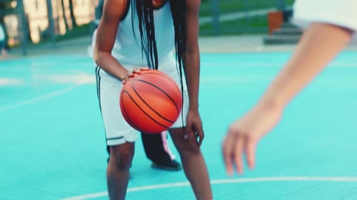 Basketball Players Practicing Skills on Outdoor Court