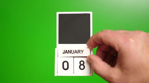 Hand Changes Date on Block Calendar