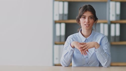 Young Woman Teaching an Online Class From Her Home Office