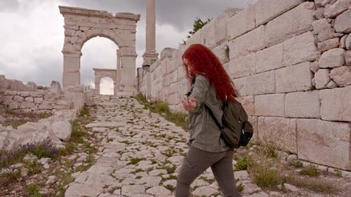 Woman Engaging with Camera in Sagalassos Ancient City Ruins