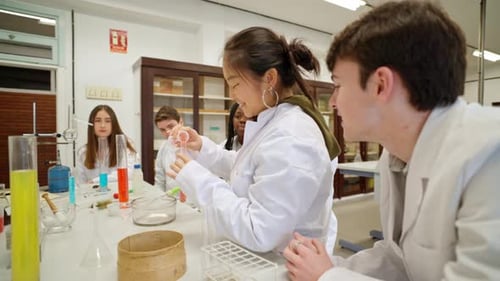 Young Adults Doing Science Experiment in a Lab