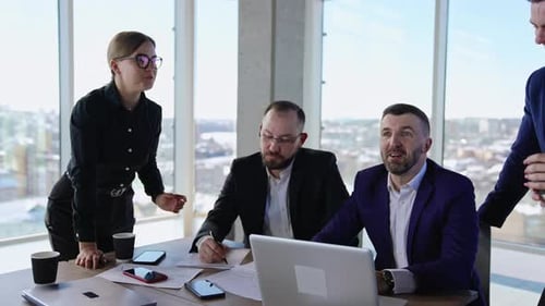 Adult business people brainstorming in the office.