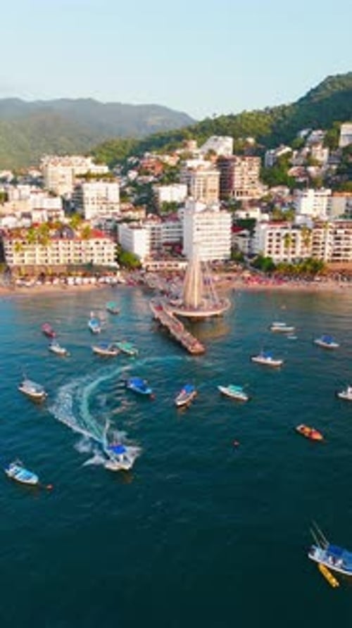 Water taxi leaving the pier in Puerto Vallarta, Mexico. Aerial view of the Zona Romantica