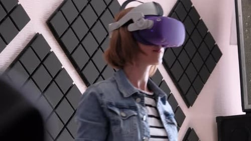 Woman Uses Virtual Reality Headset at Home