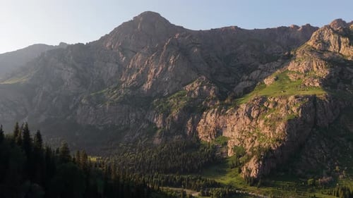 Majestic Mountain Range Bathed in Golden Sunlight at Dawn