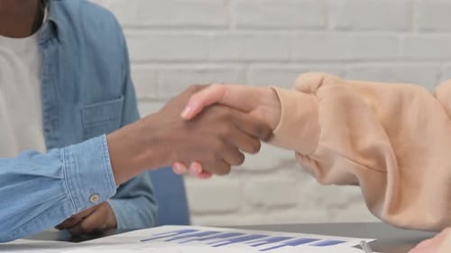 Close Up of Handshake by Multi Ethnic People