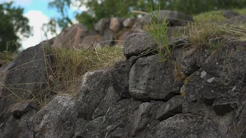 A close-up view of a boundary wall made of stone of a fortress.