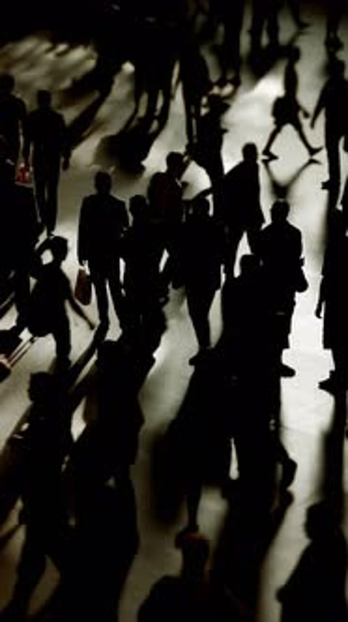 Silhouetted People Walking in an Urban Area