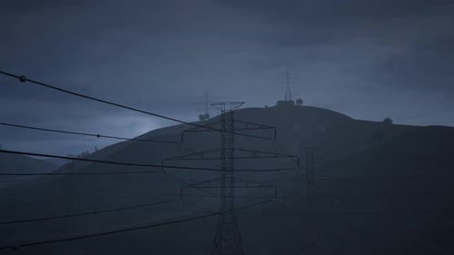 The High Voltage Electricity Tower And The Thunder On Night Dark Sky