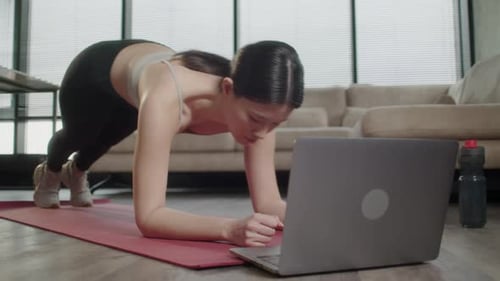 Woman Doing Plank Workout at Home
