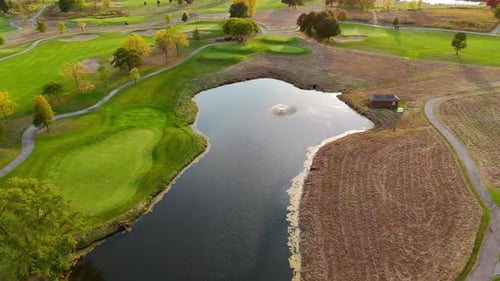 Aerial View of Scenic Golf Course Pond Drone Image of a Golf Course with Lush Green Fairways a