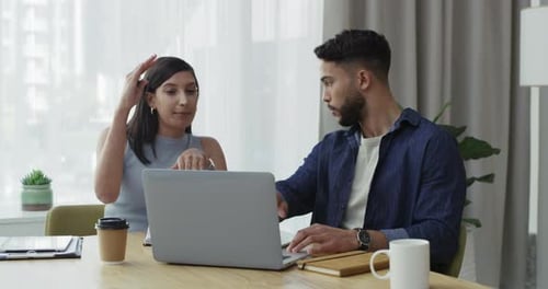 4k video footage of two businesspeople having a meeting in an office at work