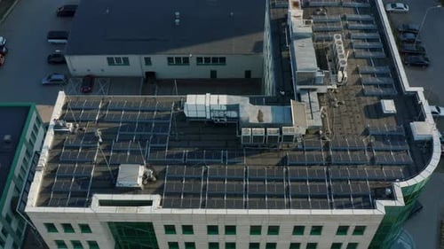 Aerial View Solar Panels On Apartment Building Roof Aerial Renewable Energy View