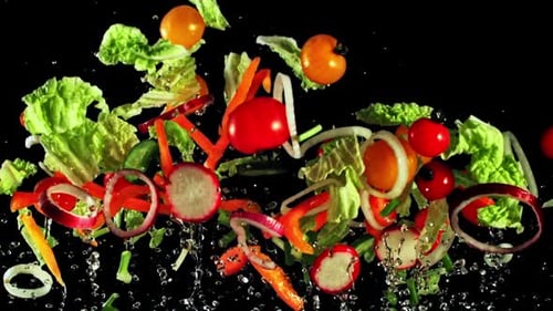 Vegetables Flying Upwards on a Black Background