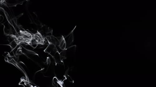Wispy smoke rising on black background animation