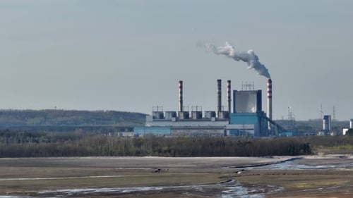 drone rotate around coal power station plant with white smoke smog polluted co2 released from