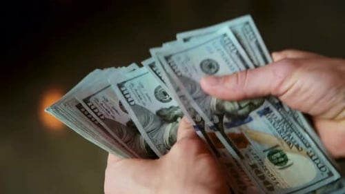 counting money, dollar money. counting cash