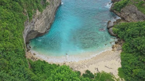 Aerial drone flying over sunfish beach nusa penida bali